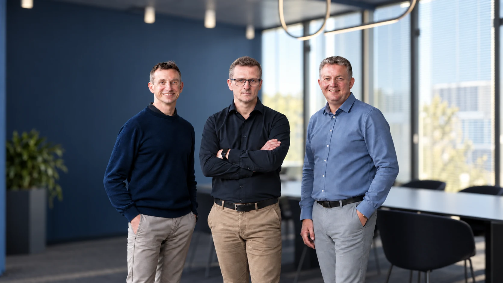 Three DNA Solutions colleagues standing together
